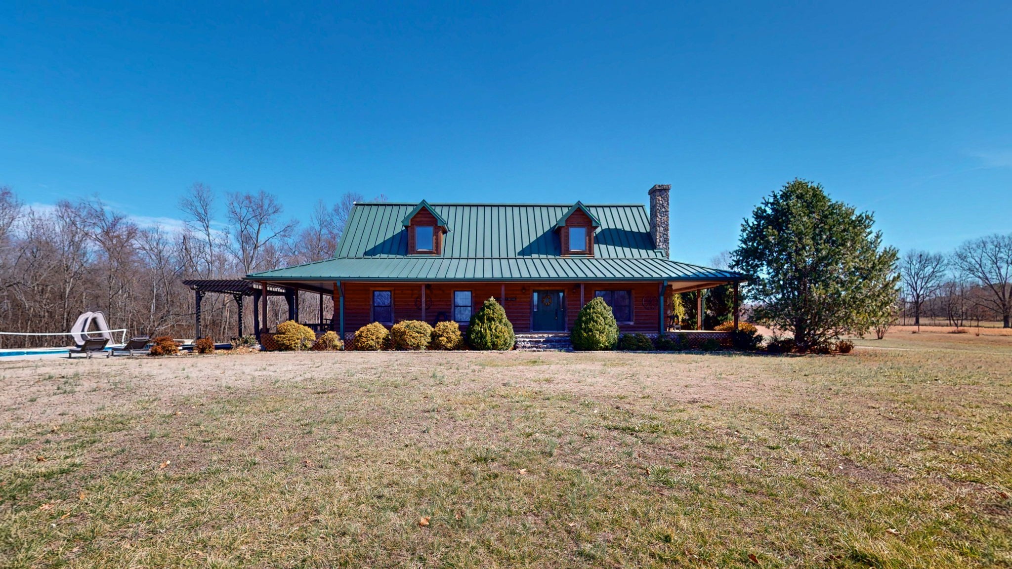 955 Martin Mill Road Puryear, TN 38251 - Photo 1 of 55 a view of a big house with wooden fence