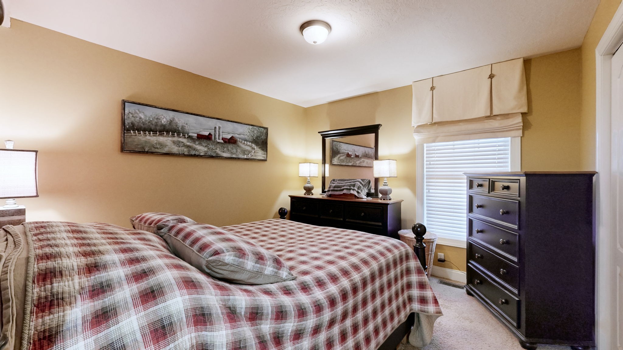 955 Martin Mill Road Puryear, TN 38251 - Photo 13 of 55 a bedroom with a bed and dresser