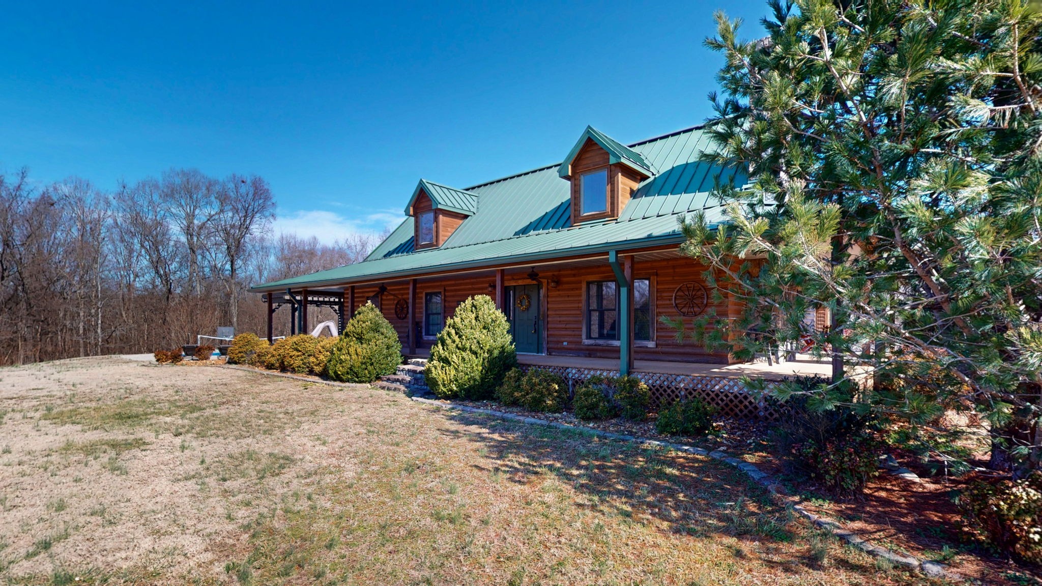 955 Martin Mill Road Puryear, TN 38251 - Photo 27 of 55 a front view of a house with garden