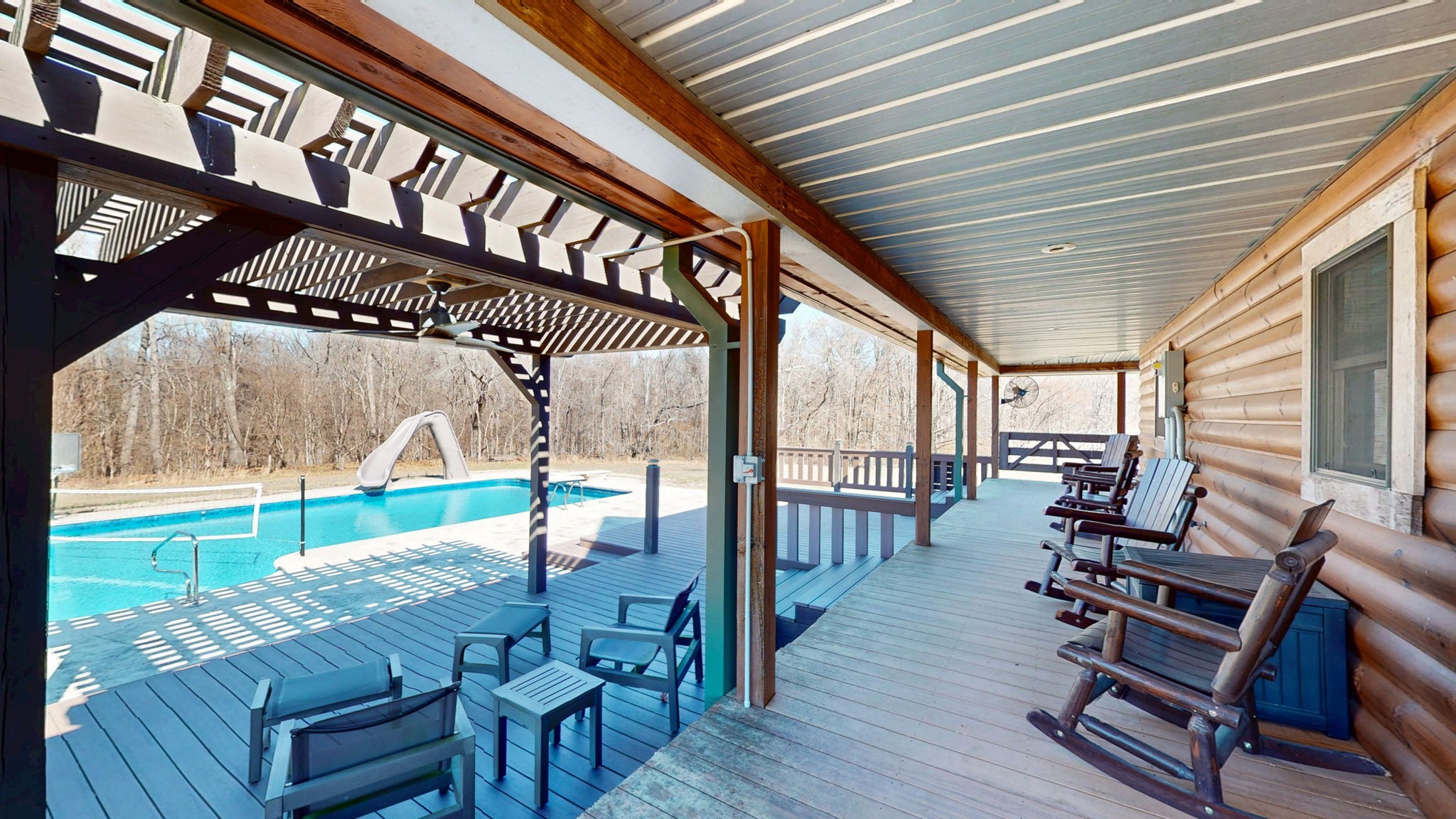 955 Martin Mill Road Puryear, TN 38251 - Photo 31 of 55 a view of a patio with table and chairs with wooden floor and fence