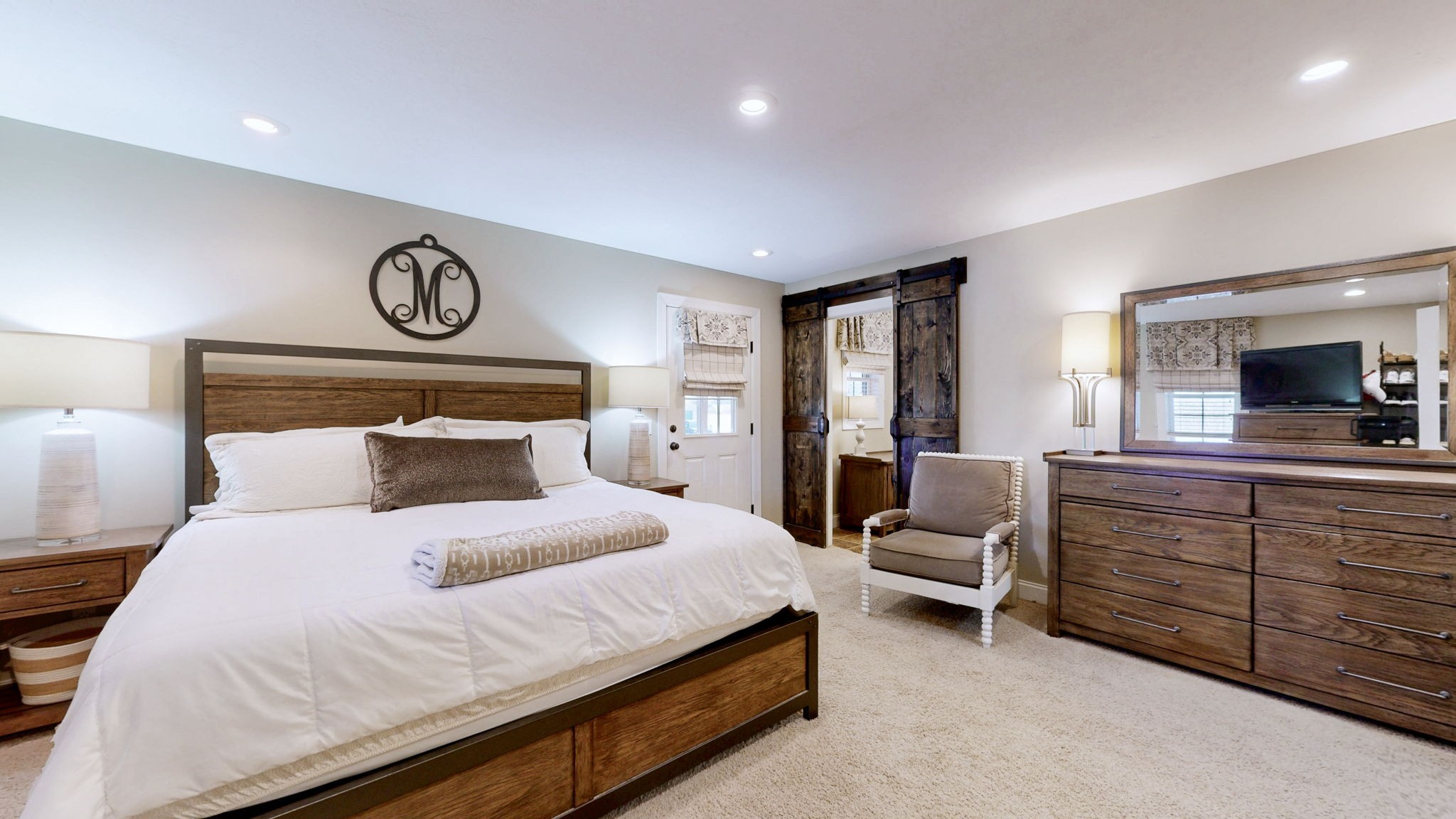 955 Martin Mill Road Puryear, TN 38251 - Photo 9 of 55 a bedroom with a bed and a television