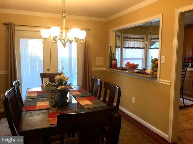 9202 Oregold Court Laurel, MD 20708 - Photo 12 of 29 a view of a dining room with furniture and window