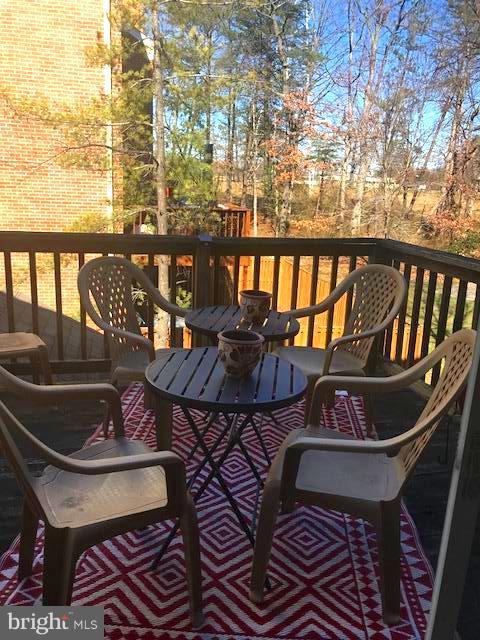 9202 Oregold Court Laurel, MD 20708 - Photo 17 of 29 a view of a chairs and table in the balcony