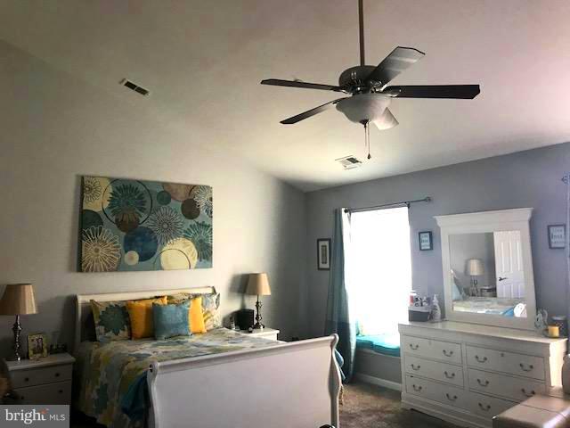 9202 Oregold Court Laurel, MD 20708 - Photo 18 of 29 a bedroom with a bed and a chandelier