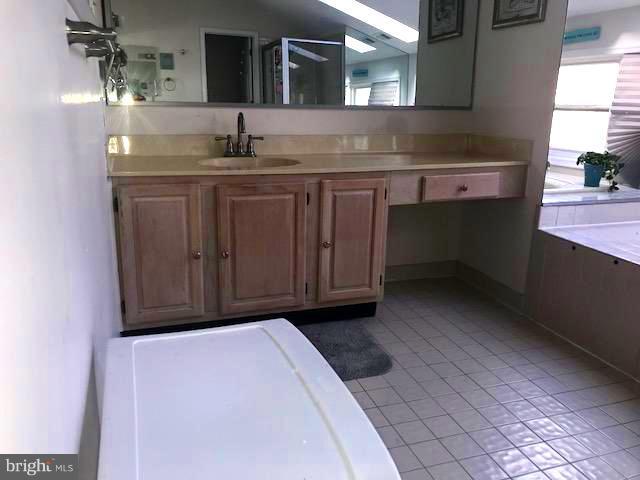 9202 Oregold Court Laurel, MD 20708 - Photo 24 of 29 a room with a sink and a mirror