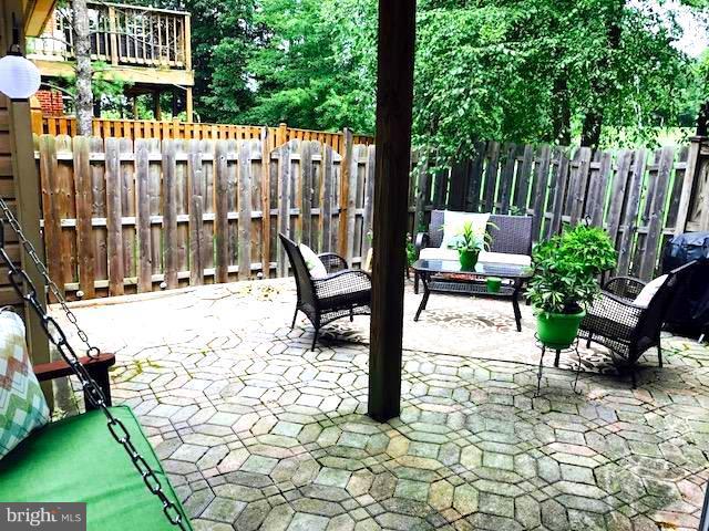 9202 Oregold Court Laurel, MD 20708 - Photo 28 of 29 a view of a chairs and bench in the yard