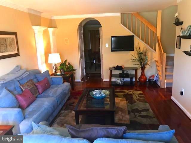 9202 Oregold Court Laurel, MD 20708 - Photo 6 of 29 a living room with furniture and a flat screen tv