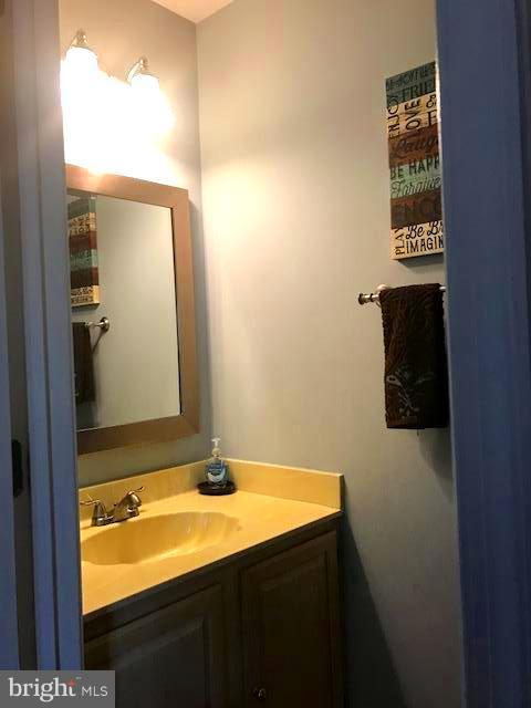 9202 Oregold Court Laurel, MD 20708 - Photo 7 of 29 a bathroom with a sink and a mirror