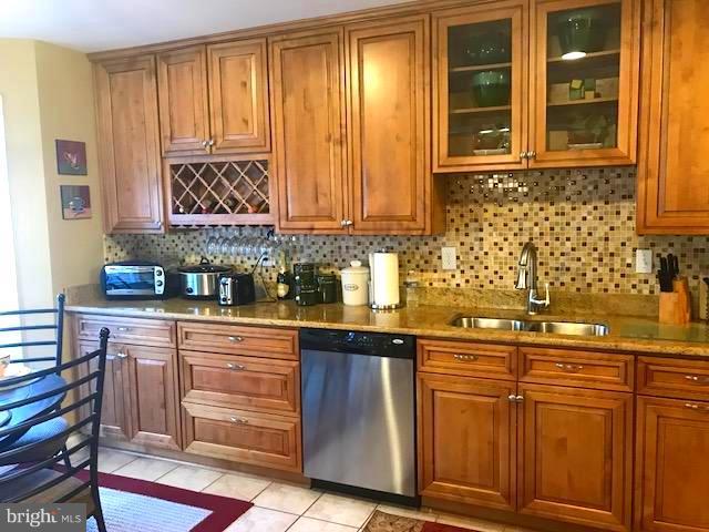 9202 Oregold Court Laurel, MD 20708 - Photo 10 of 29 a kitchen with stainless steel appliances granite countertop a sink and cabinets