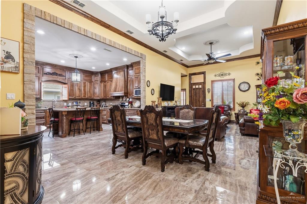 717 West 27th Street Mission, TX 78574 - Photo 2 of 18 a view of a dining room with furniture window and wooden floor