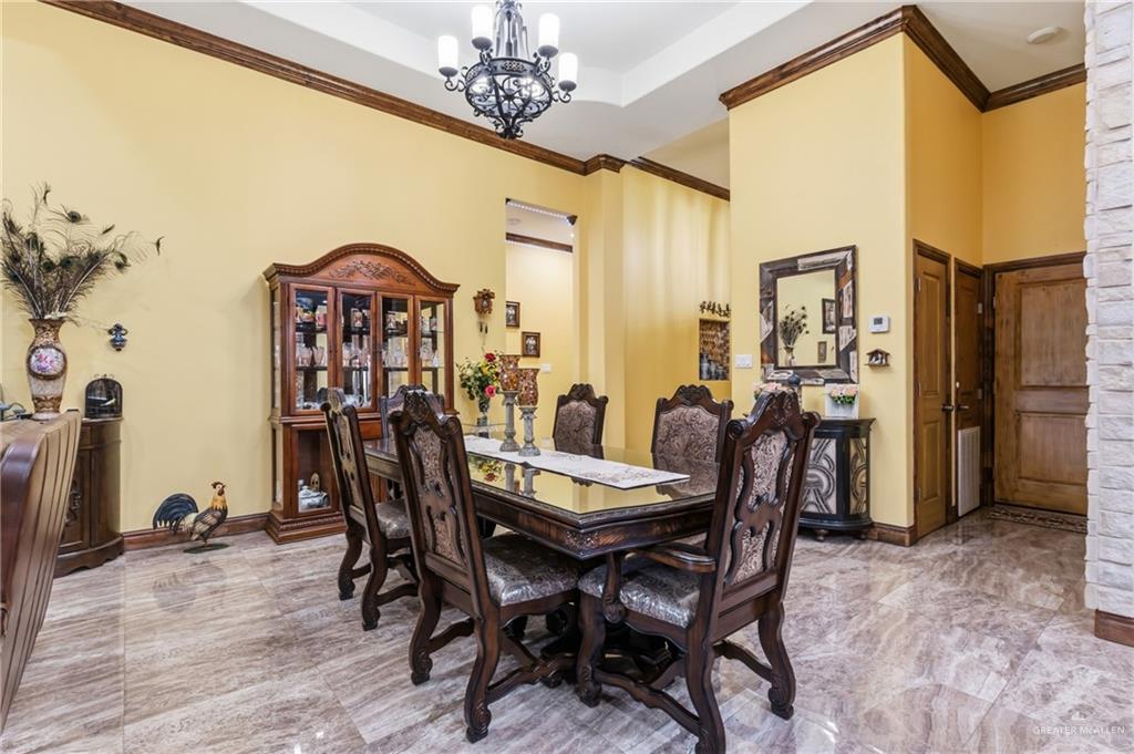 717 West 27th Street Mission, TX 78574 - Photo 5 of 18 a view of a dining room with furniture and a chandelier