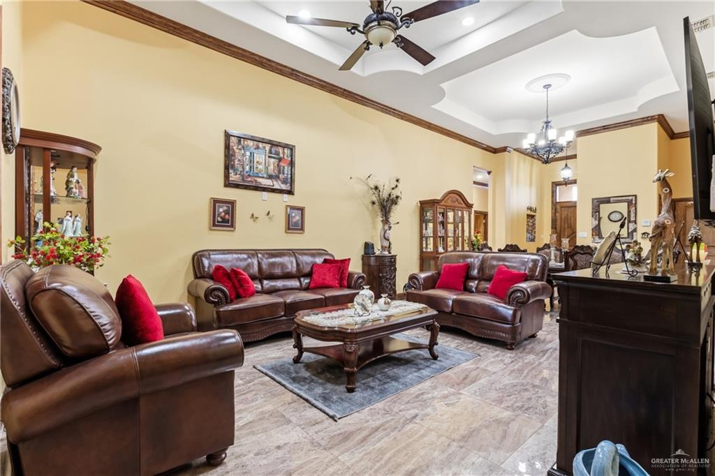717 West 27th Street Mission, TX 78574 - Photo 6 of 18 a living room with furniture and a chandelier