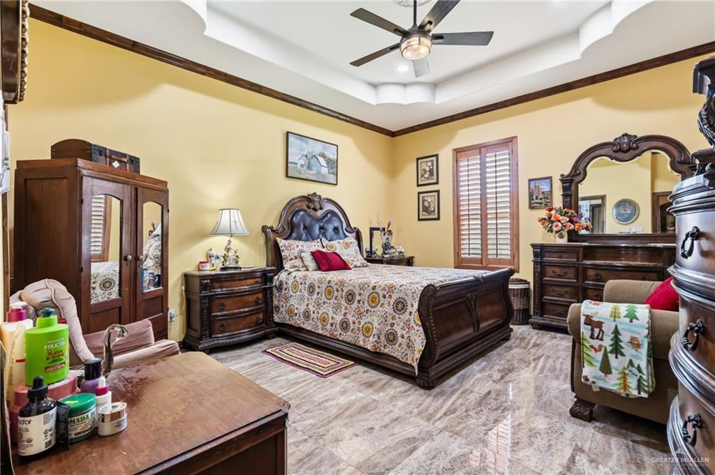 717 West 27th Street Mission, TX 78574 - Photo 8 of 18 a bedroom with a bed dresser and a window