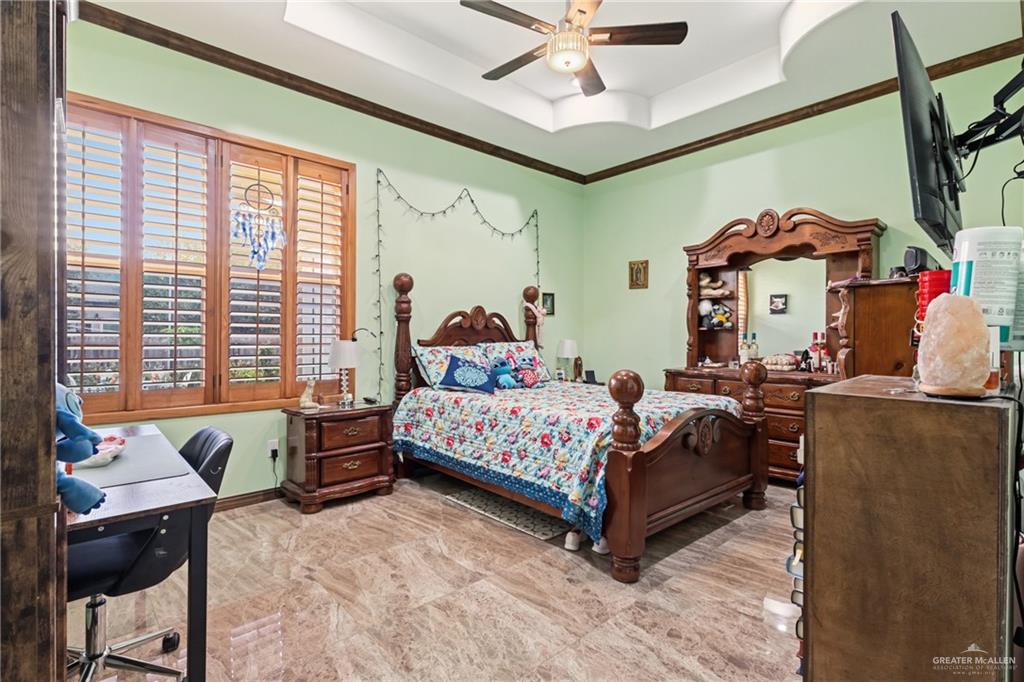 717 West 27th Street Mission, TX 78574 - Photo 9 of 18 a bedroom with a bed and wooden floor