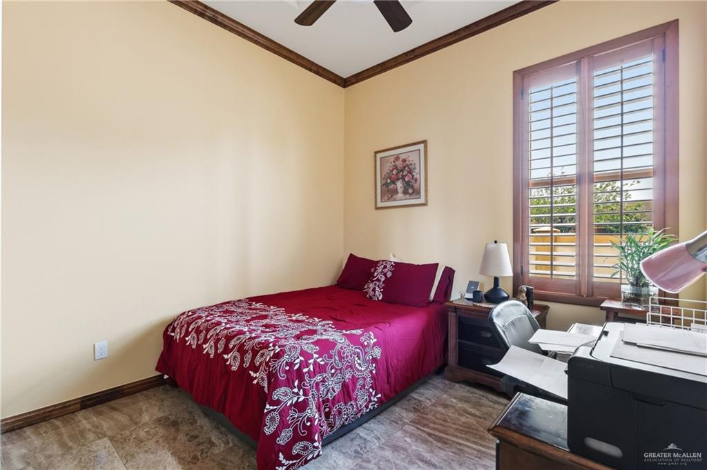 717 West 27th Street Mission, TX 78574 - Photo 10 of 18 a bedroom with a bed and wooden floor