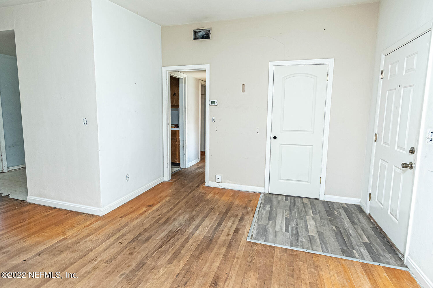 2445 Community Road Jacksonville, FL 32207 - Photo 13 of 42 a view of a room with wooden floor and hallway