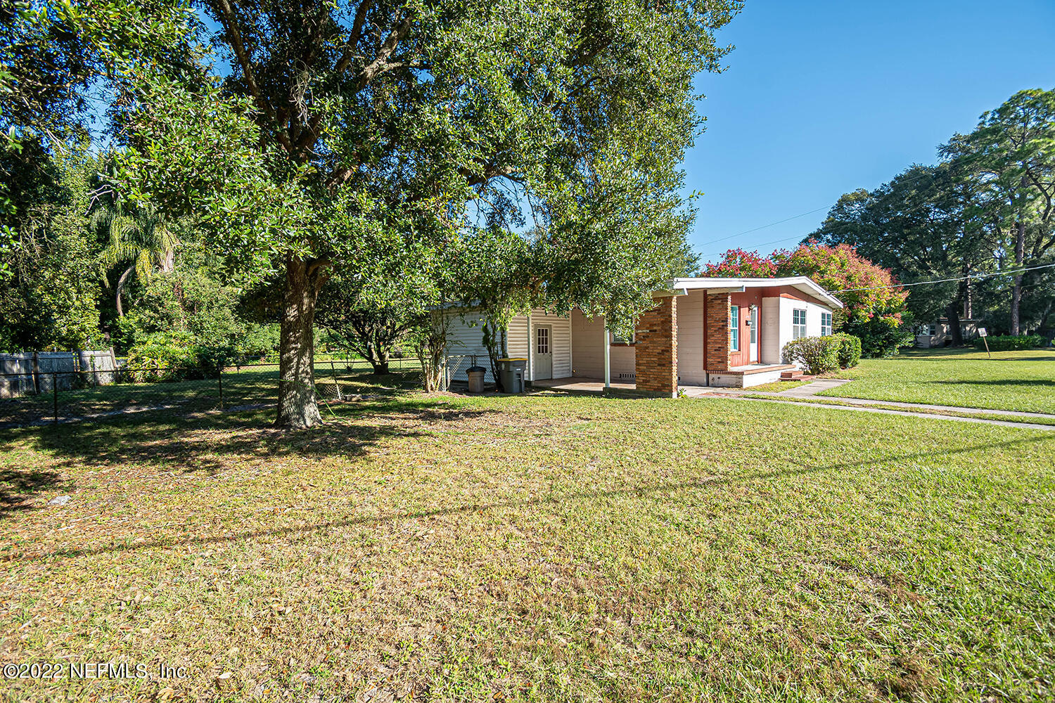 2445 Community Road Jacksonville, FL 32207 - Photo 36 of 42 a front view of a house with a yard