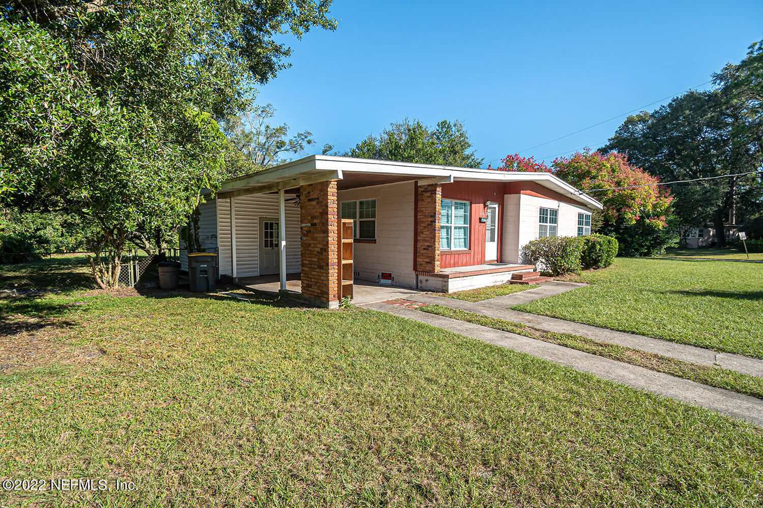 2445 Community Road Jacksonville, FL 32207 - Photo 5 of 42 a front view of a house with a yard