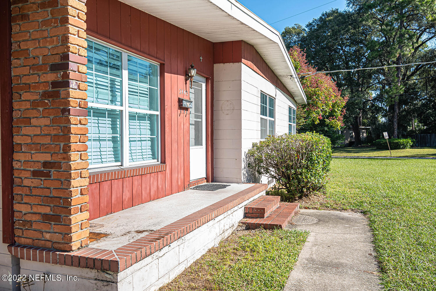 2445 Community Road Jacksonville, FL 32207 - Photo 6 of 42 a front view of a house with garden