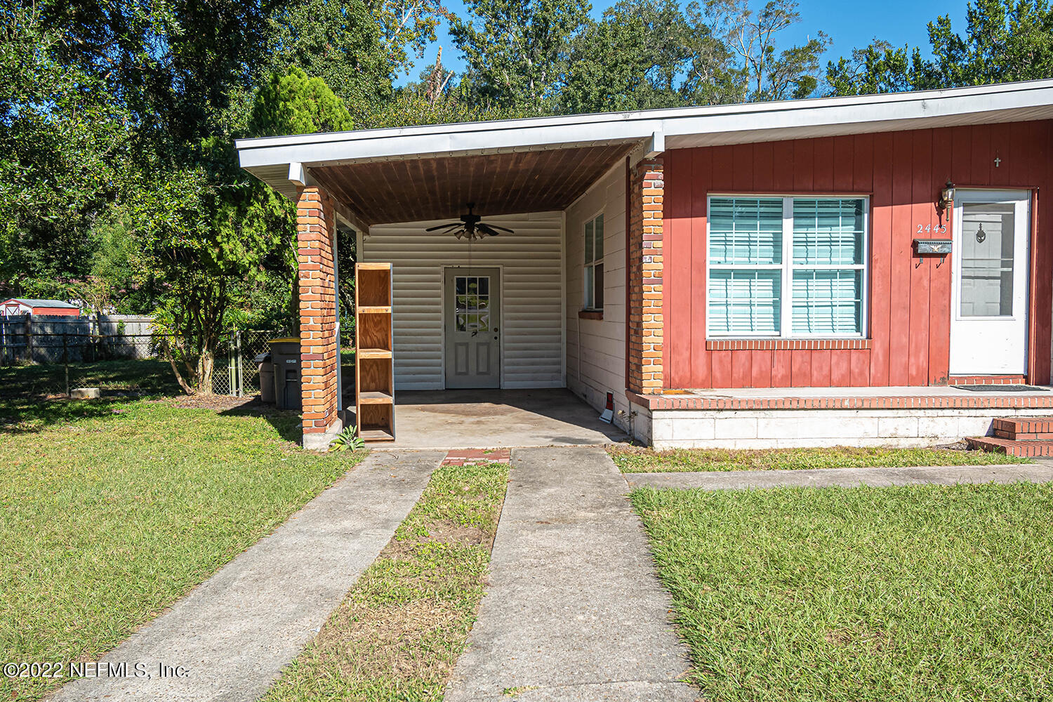 2445 Community Road Jacksonville, FL 32207 - Photo 10 of 42 a front view of a house with a yard