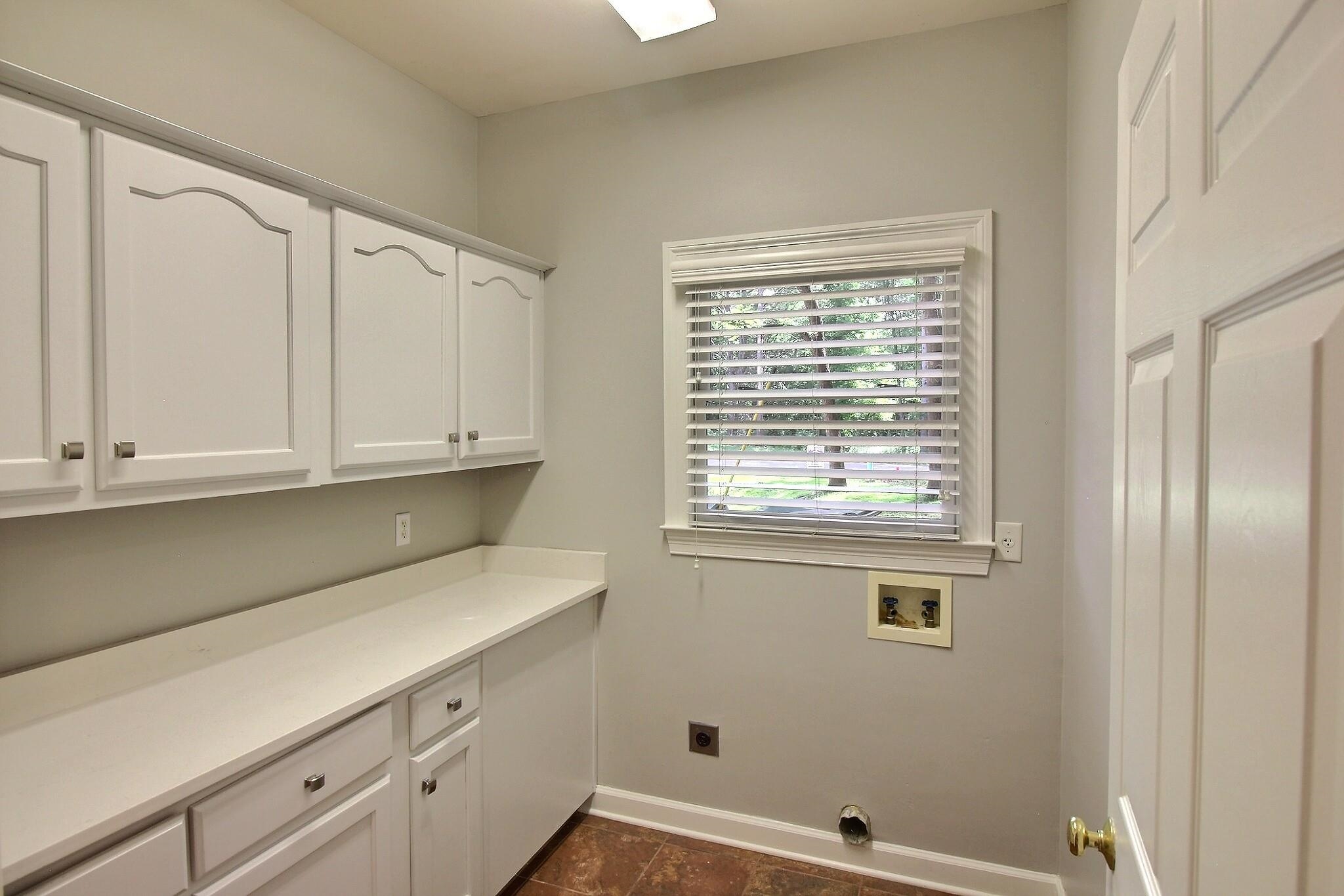 255 Ellawood Lane Collierville, TN 38017 - Photo 24 of 38 a kitchen with a white cabinets and a window
