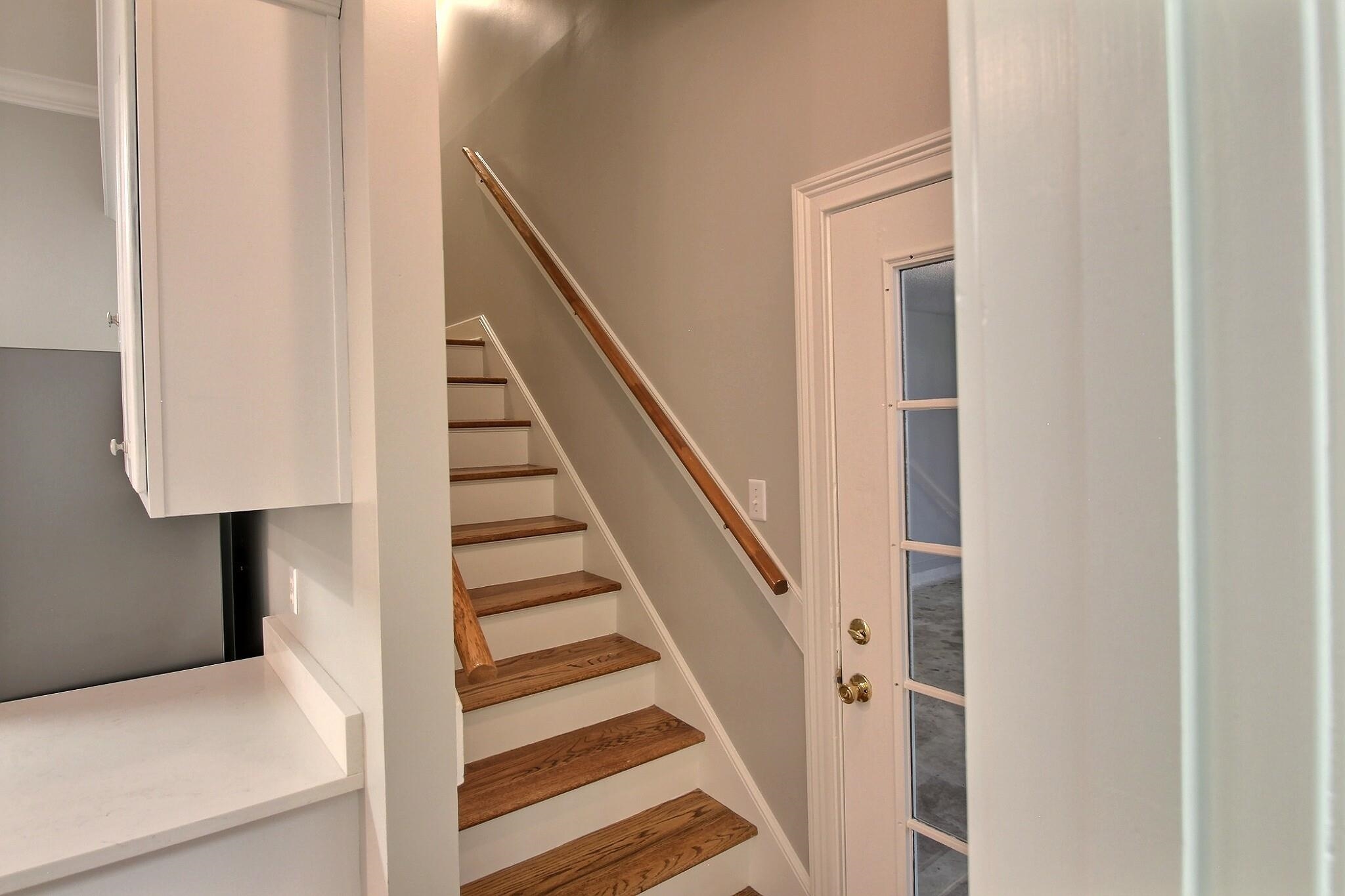 255 Ellawood Lane Collierville, TN 38017 - Photo 25 of 38 a view of staircase with wooden floor and white walls