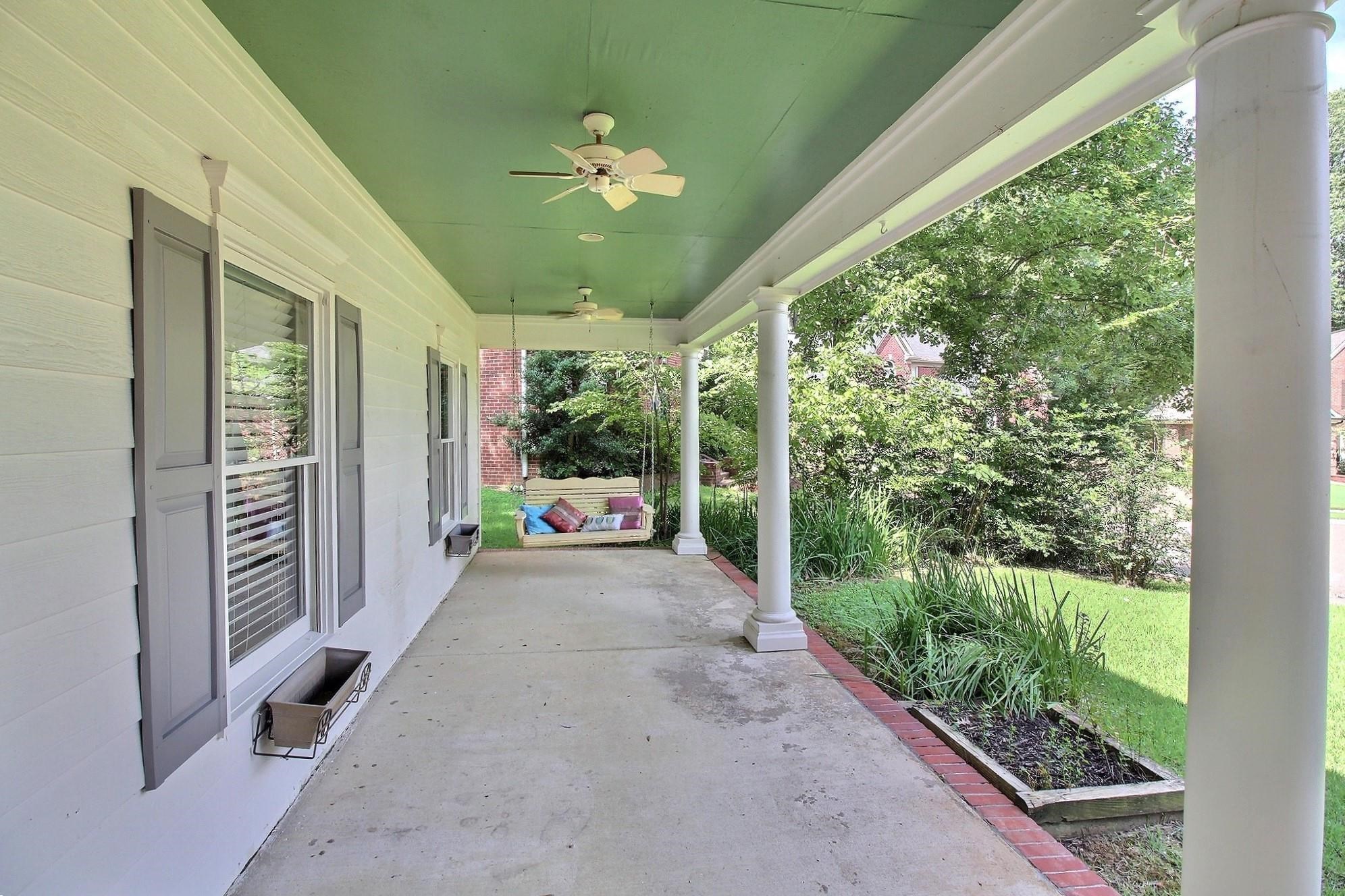 255 Ellawood Lane Collierville, TN 38017 - Photo 7 of 38 a view of a porch with furniture and garden