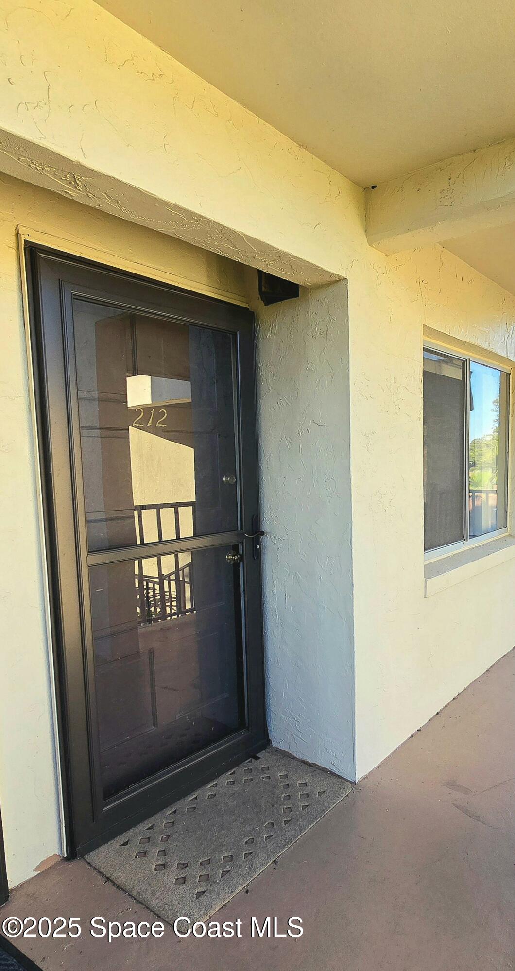 3680 Barna Avenue, Unit 212 Titusville, FL 32780 - Photo 2 of 40 Front Door