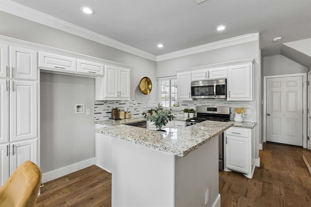 706 South Jupiter Road, Unit 307 Allen, TX 75002 - Photo 11 of 32 Well lit kitchen with stainless steel appliances