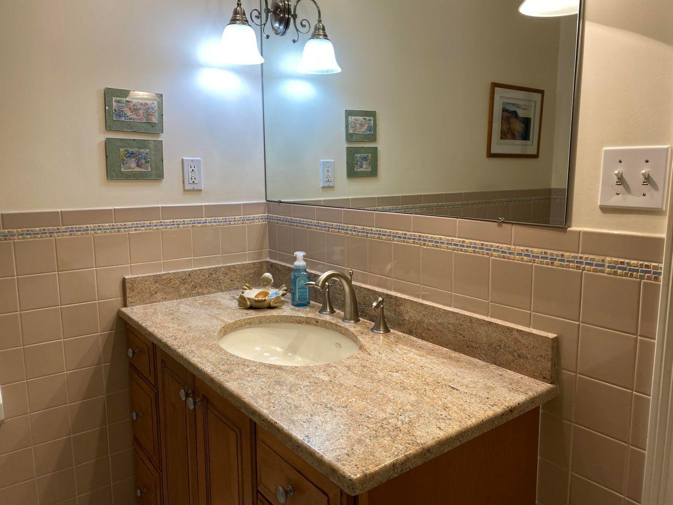 44 Island View Road Hyannis, MA 02601 - Photo 14 of 33 a bathroom with a granite countertop sink and a mirror