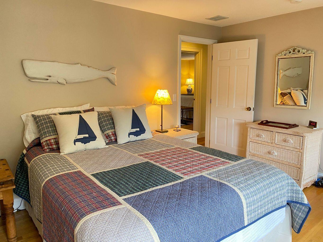 44 Island View Road Hyannis, MA 02601 - Photo 15 of 33 a bedroom with a bed and wooden floor