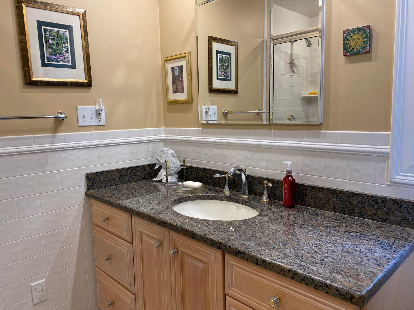 44 Island View Road Hyannis, MA 02601 - Photo 17 of 33 a bathroom with a sink and a mirror
