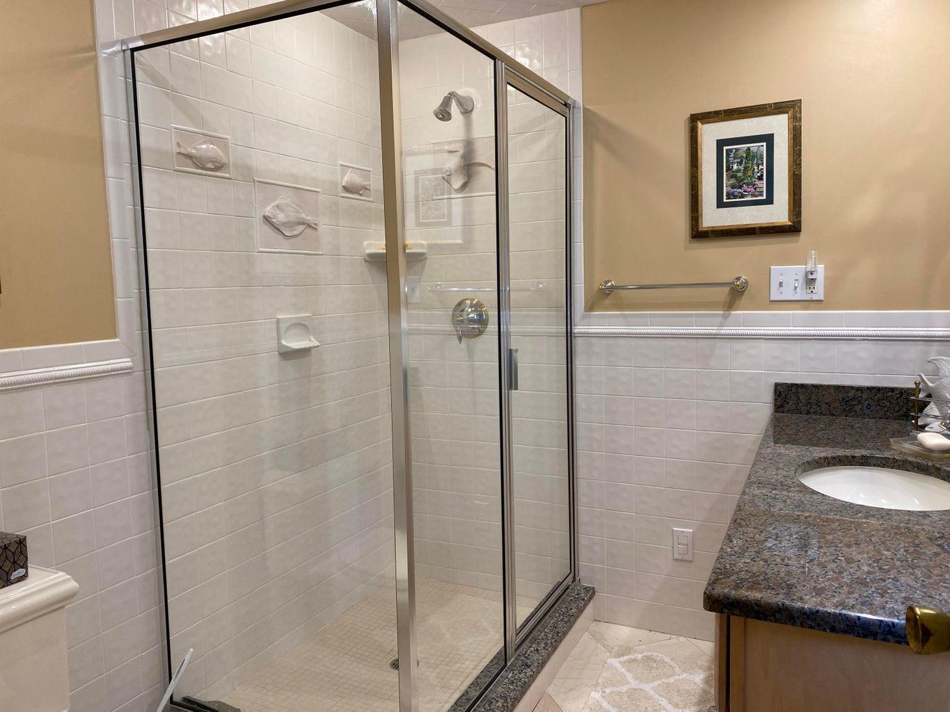 44 Island View Road Hyannis, MA 02601 - Photo 18 of 33 a bathroom with a granite countertop sink a mirror and a shower