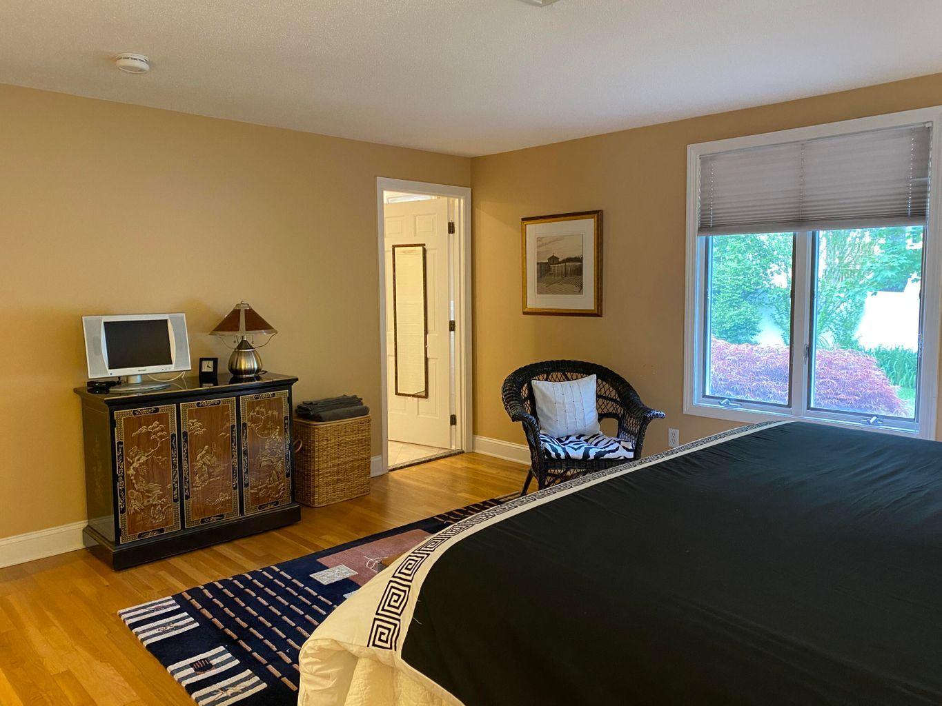 44 Island View Road Hyannis, MA 02601 - Photo 19 of 33 a bedroom with a bed and wooden floor