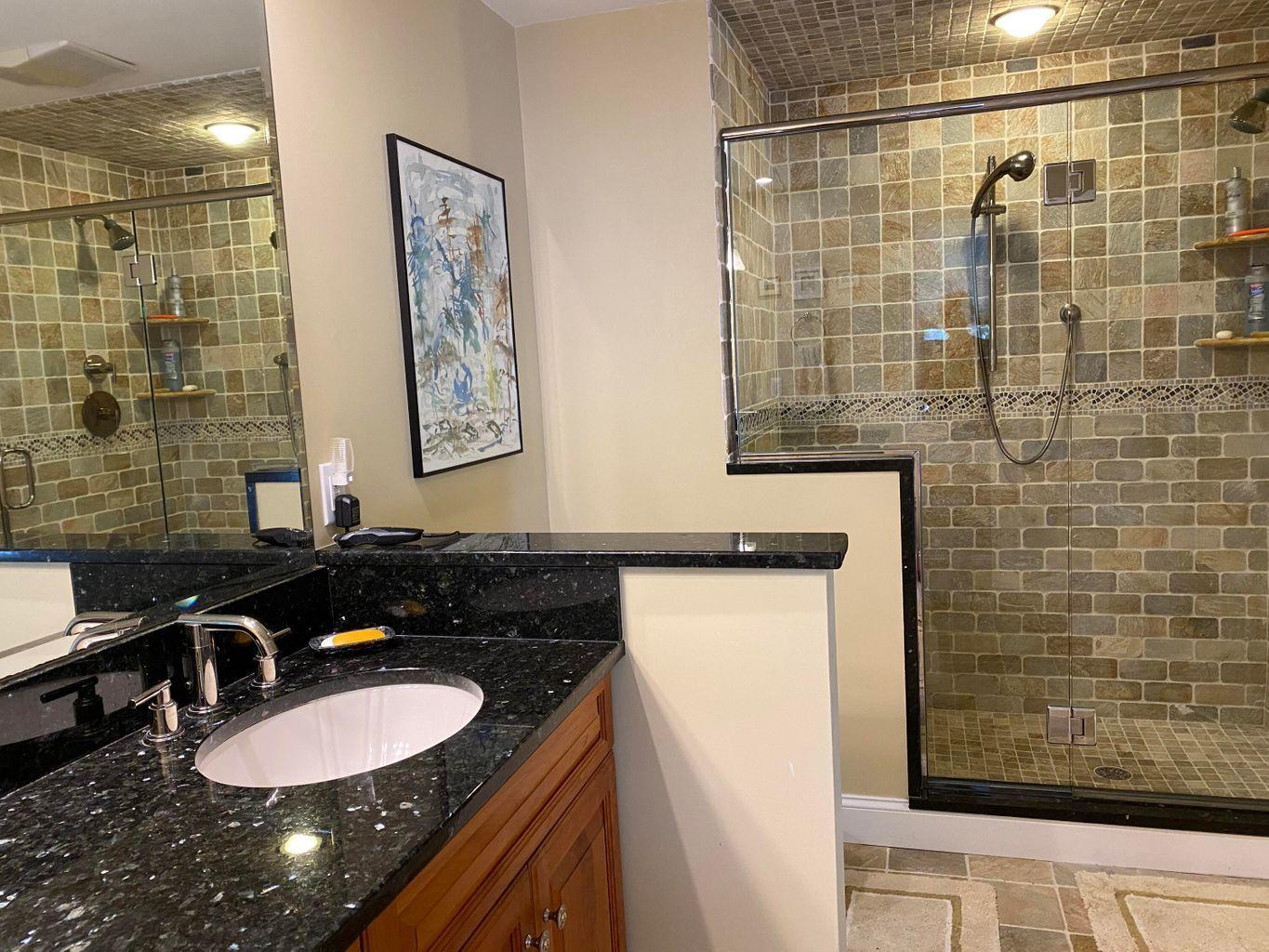 44 Island View Road Hyannis, MA 02601 - Photo 25 of 33 a bathroom with a sink a toilet and shower