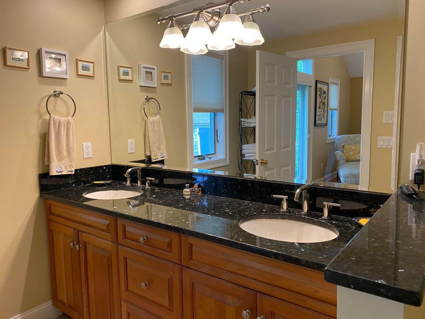 44 Island View Road Hyannis, MA 02601 - Photo 26 of 33 a bathroom with a granite countertop sink and a mirror