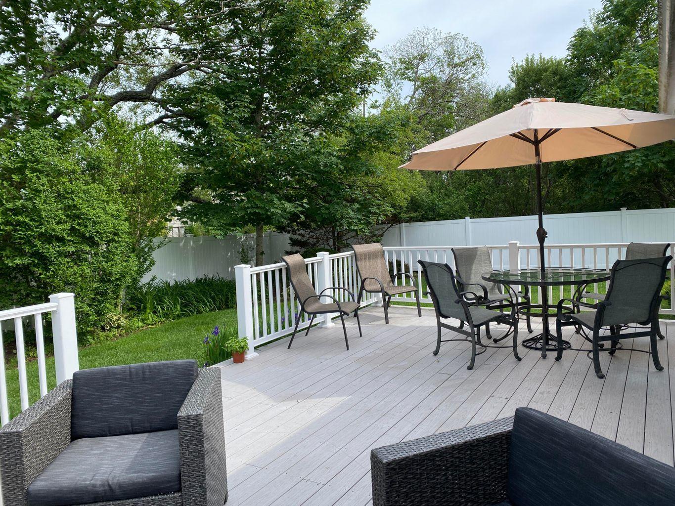 44 Island View Road Hyannis, MA 02601 - Photo 5 of 33 a view of table and chairs under an umbrella