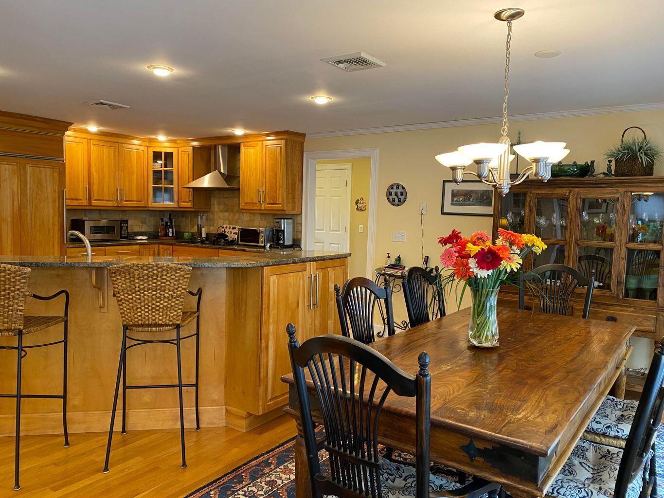 44 Island View Road Hyannis, MA 02601 - Photo 8 of 33 a dining room filled chandelier and kitchen view