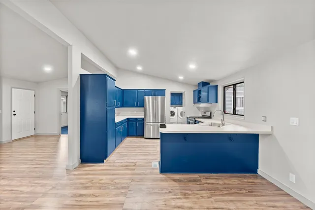 a view of kitchen with sink and window