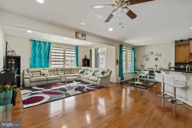 a living room with furniture and floor to ceiling window
