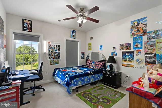 a bedroom with bed and a window