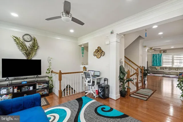 a bedroom with furniture and a flat screen tv