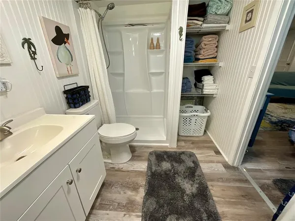 a bathroom with a sink toilet and shower