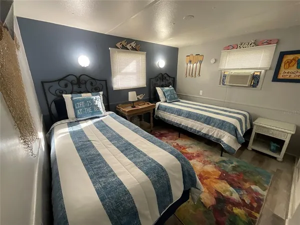 a bedroom with double bed and a night stand