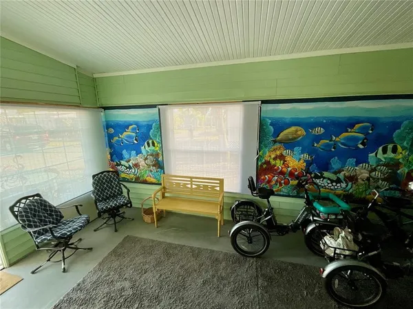 a room with furniture and a potted plant
