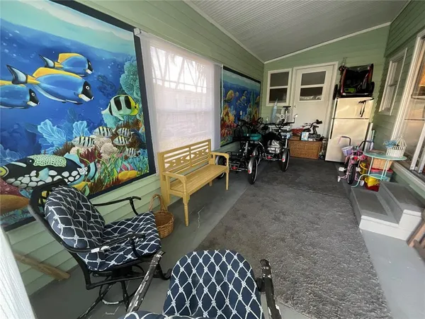 a view of a chairs and table in patio