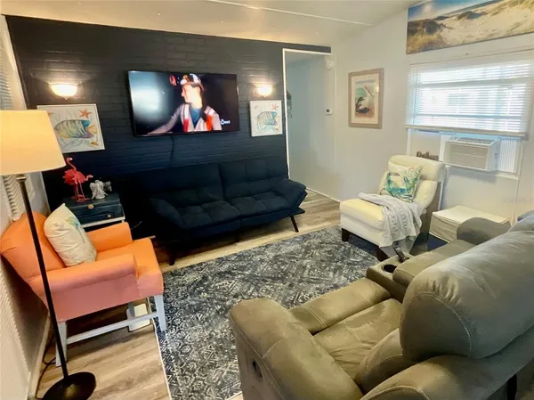 a living room with furniture and a window