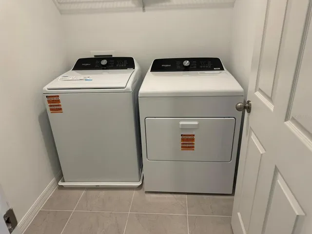 a utility room with dryer and washer