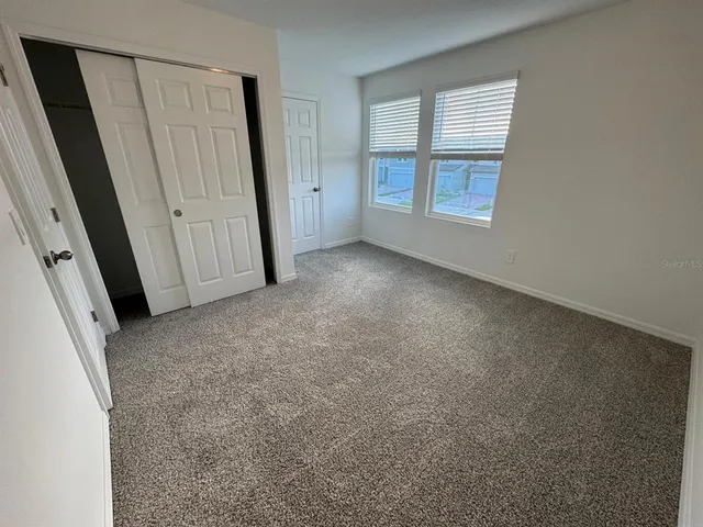 an empty room with windows