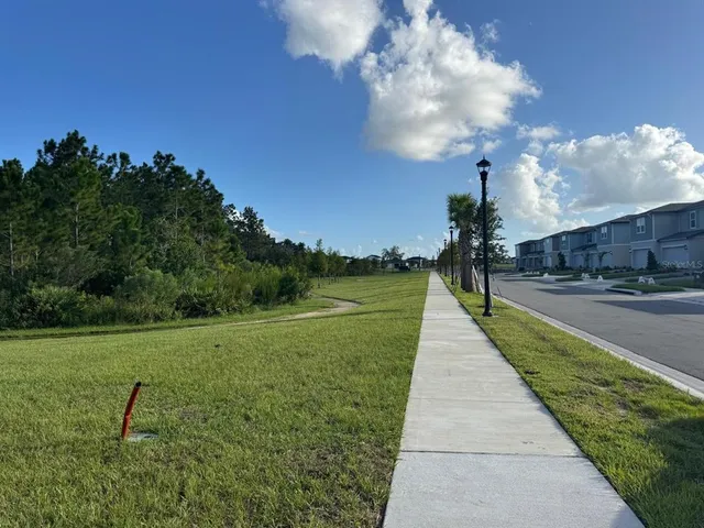 a park view with a entertaining space in back